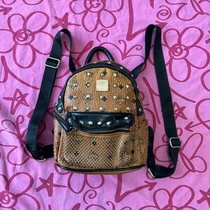 MCM mini backpack bag purse. Studded. Cognac color